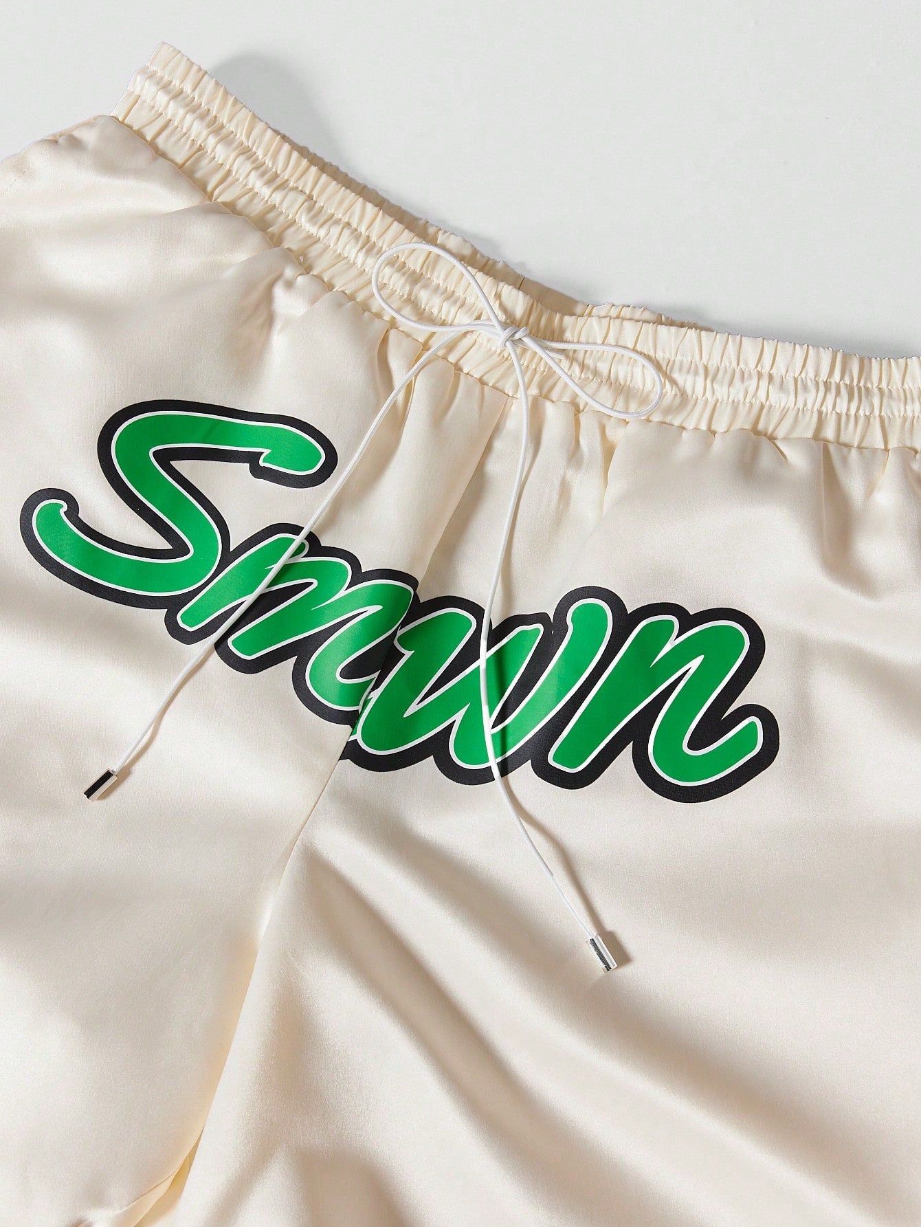 Satin Shorts With Curved Hem And Front Print